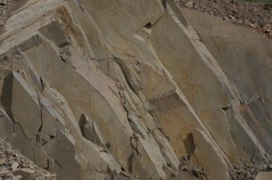 This is the porphyry face of a quarry surface. The rock is stratified